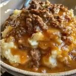 GROUND BEEF AND GRAVY OVER MASHED POTATOES